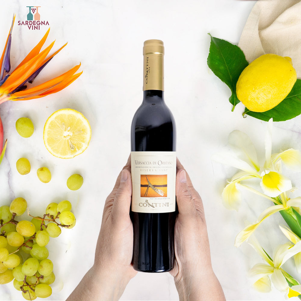 Bottle of Vernaccia di Oristano Riserva DOC by Cantina Contini, showcasing a white wine with a golden hue.