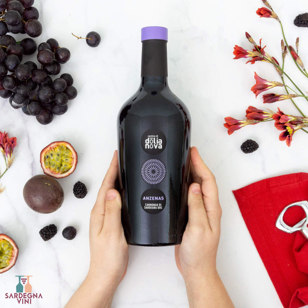 Bottle of Anzenas Cannonau di Sardegna 2023, a red wine from Cantine di Dolianova, featuring a deep red hue.