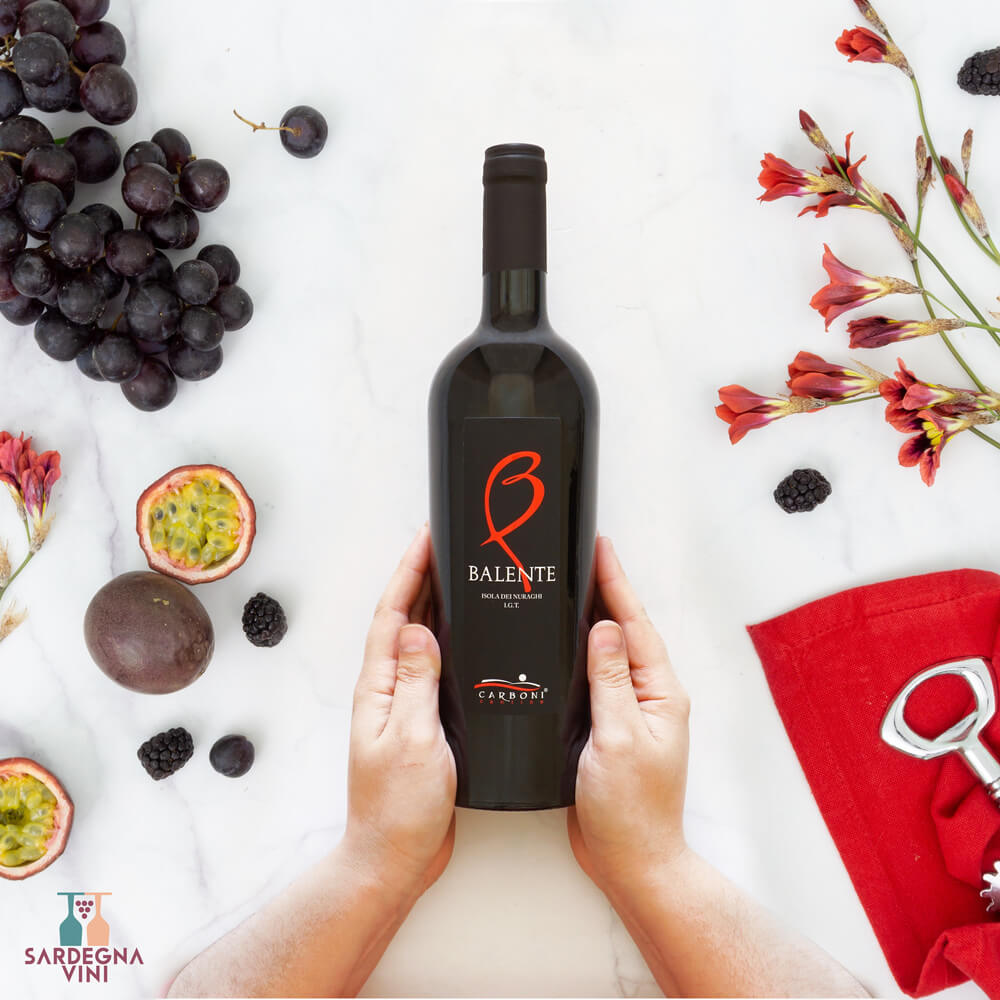 Bottle of Balente Isola dei Nuraghi IGT 2022 red wine by Cantina Carboni with a rich, deep red color.