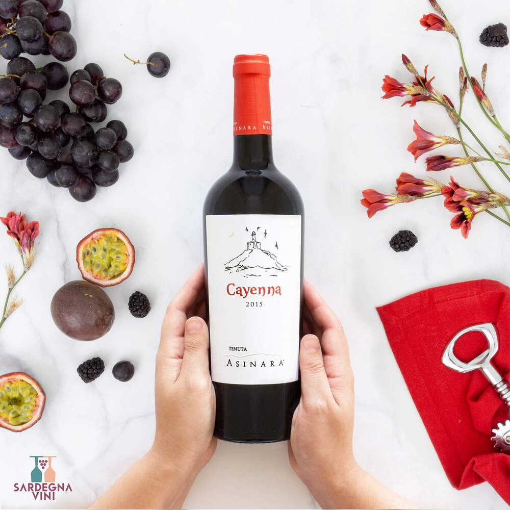 Cayenna Isola dei Nuraghi IGT 2018 white wine bottle by Tenuta Asinara with elegant label design displayed on a table.