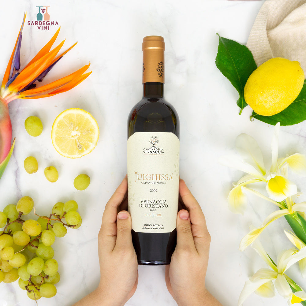 Juighissa Vernaccia di Oristano Superiore DOC 2016 white wine bottle with elegant label and cork.