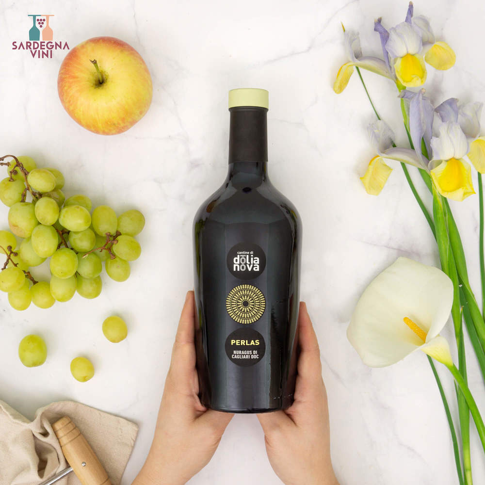 Perlas Nuragus di Cagliari 2024 wine bottle from Cantine di Dolianova with elegant label design and pale yellow liquid.