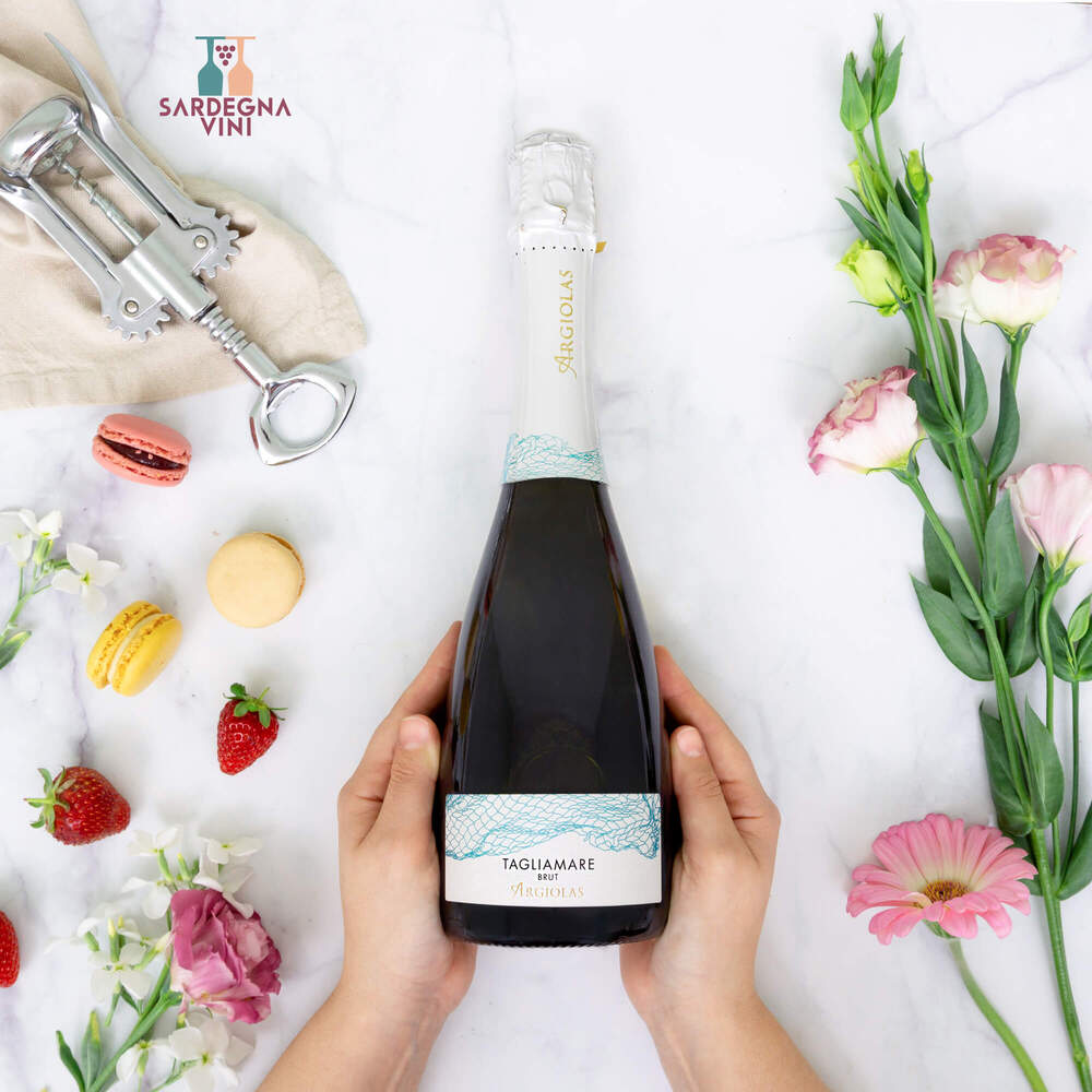 Tagliamare Spumante Brut bottle with elegant label, showcasing Cantina Argiolas sparkling wine against a soft background.